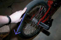 make_wheel_spin_and_make_sure_it_spins_smoothly.jpg (43843 bytes)